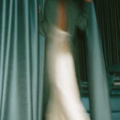Color Blue Volume 1 title over a motion-blurred figure framed by deep teal curtains.