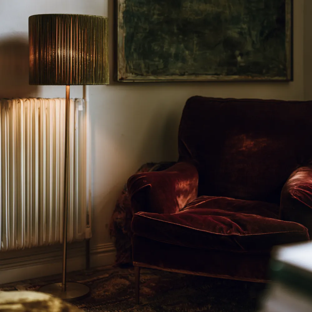 An armchair in autumn with reading lamp the Autumn Edit Stock collection