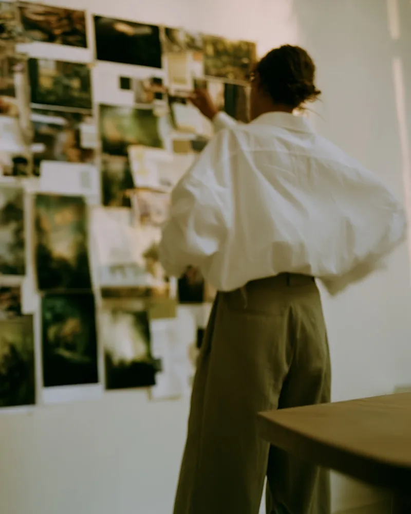 Alter Edit ready-built Systeme.io business systems making brand coherence easier. woman looking at her brand moodboard